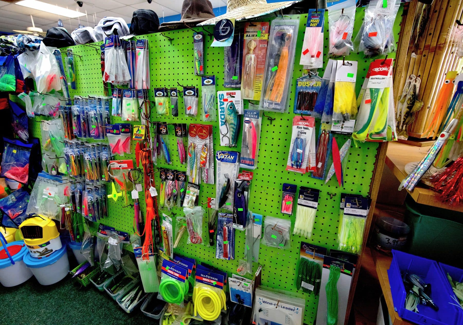 Green pegboard of offshore trolling lures with Sea Striker surgical tubing, Boone skirts, Rapala Sarda and No Alibi Alien Jig